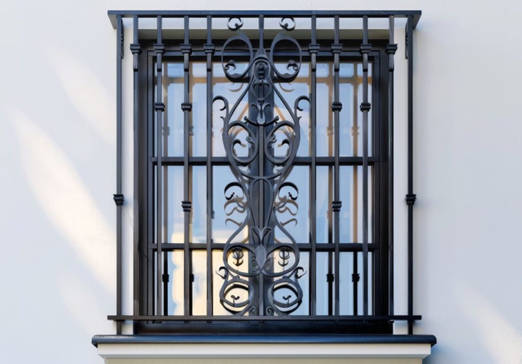 A window with bars and a decorative pattern. White walls in the background. 